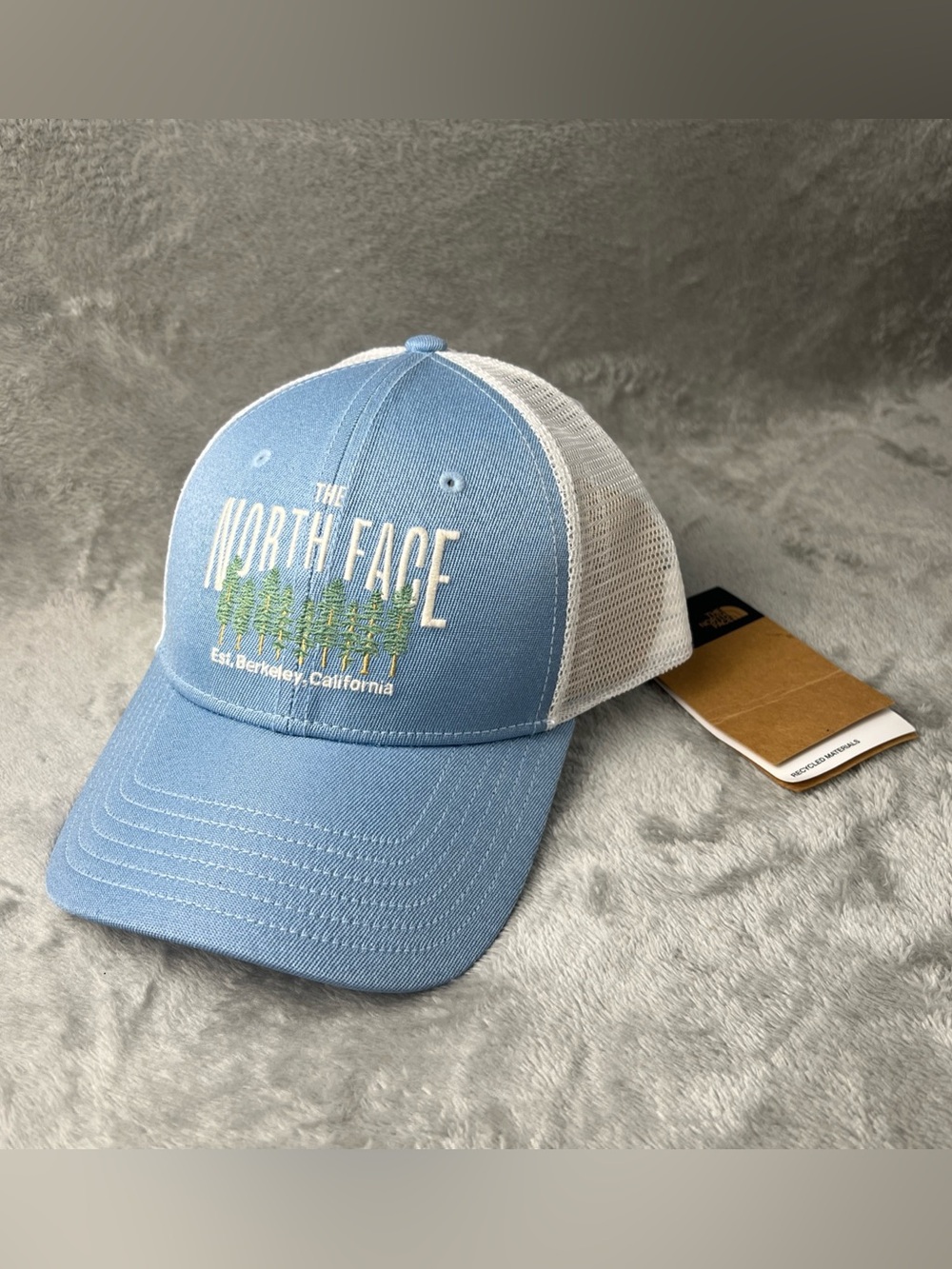 The North Face Mudder Trucker Hat Embroidered trees Logo light blue Berkley
